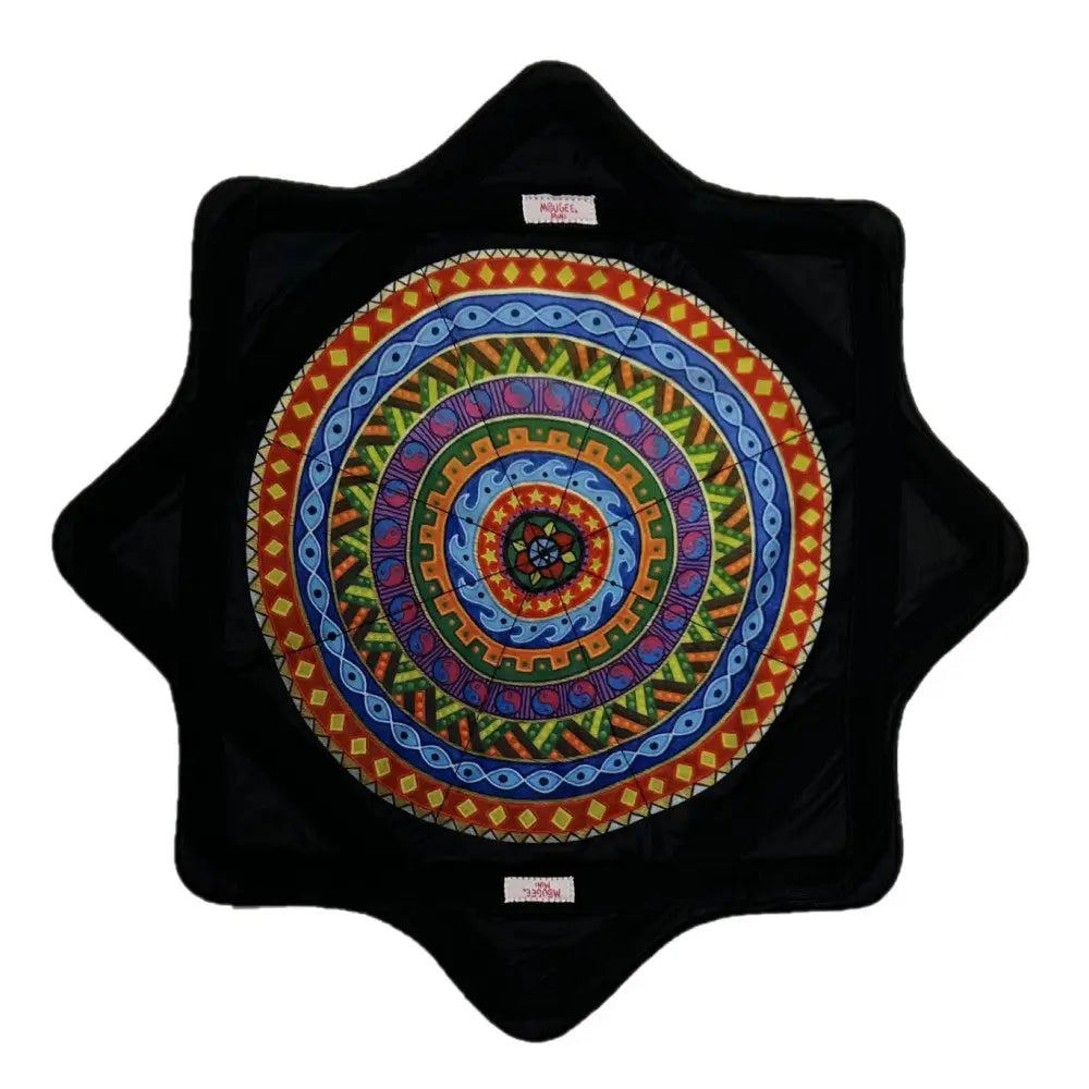 Black star-shaped plate with colorful spiral design and textured surface.