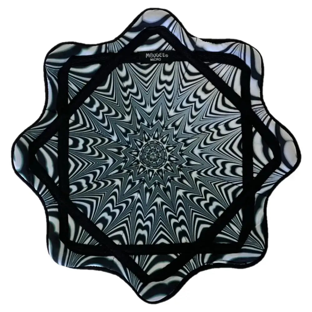 Black and white starburst patterned cushion with a textured surface.