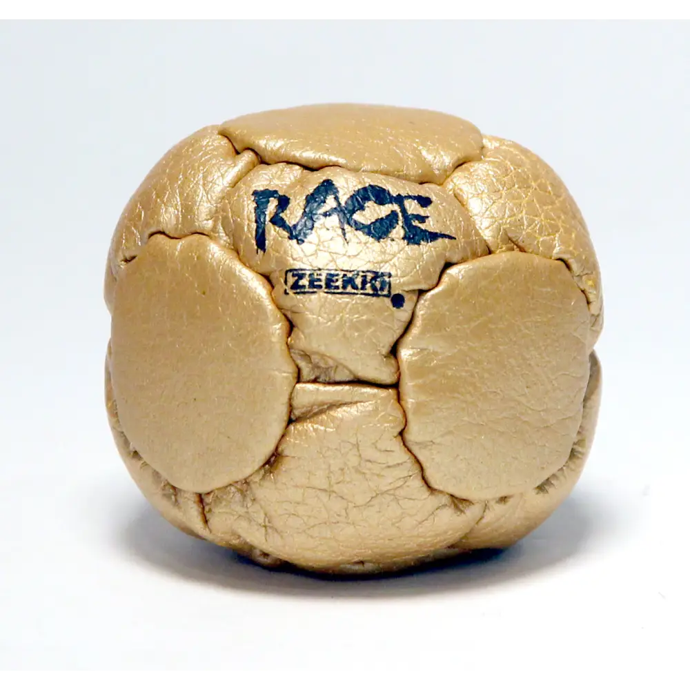 Gold metallic cube with ’race’ and ’zeerio’ text.