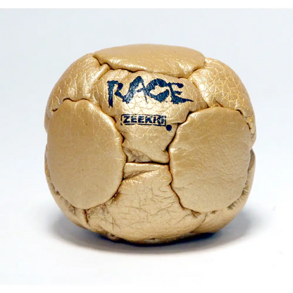 Gold metallic cube with ’race’ and ’zeerio’ text.